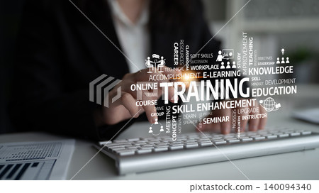 Hands on keyboard illustrating training concepts with keywords related to online learning, skill enhancement, education and professional development in the workplace. Tessel Hands on keyboard illustrating training concepts with keywords related to online learning, skill enhancement, education and professional development in the workplace. Tessel 140094340