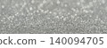 Silver glitter background displaying sparkling bokeh lights and shiny particles 140094705