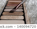 Nude eyeshadow palette showing various shimmer and matte shades. Including glitter and brown tones. Beauty products and cosmetics concepts 140094720