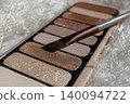 Eyeshadow palette with nude, shimmer and glitter shades perfect for daily to evening looks 140094722