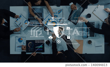 Business Team Collaboration on Data Analysis and Cybersecurity with Digital Lock Icon Overlaid on Table with Charts and Laptops Trope 140094813