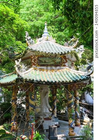 High angle view of an ornate traditional Vietnamese pagoda pavilion with green tiled roof at Marble Mountains in Da Nang Vietnam High angle view of an ornate traditional Vietnamese pagoda pavilion with green tiled roof at Marble Mountains in Da Nang Vietnam 140094855
