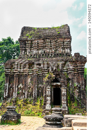 Ancient ruined red brick Hindu temple tower with stone sculptures and ornate carvings at My Son Sanctuary in Vietnam Ancient ruined red brick Hindu temple tower with stone sculptures and ornate carvings at My Son Sanctuary in Vietnam 140094872