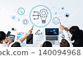 Business team collaborating on creative strategy with charts, graphs, technology, and innovative ideas represented by a light bulb and gear on desk Trope 140094968