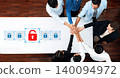 Collaborative Teamwork on Cybersecurity Solutions with Hands Joining Around Digital Locks on a Modern Table in an Office Environment Trope 140094972