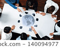 Diverse Business Team Collaborating Around Digital Globe and Data Analytics in Modern Office Setting for Global Strategy Development and Innovation Trope 140094977
