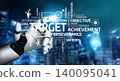 Futuristic Robotic Hand Reaching for Target Achievement in a Digital Landscape with Motivational Words and Concepts Representing Success. Tessel 140095041