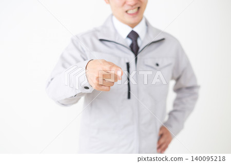 A middle-aged businessman in gray work clothes engaging in power harassment (white background) A middle-aged businessman in gray work clothes engaging in power harassment (white background) 140095218
