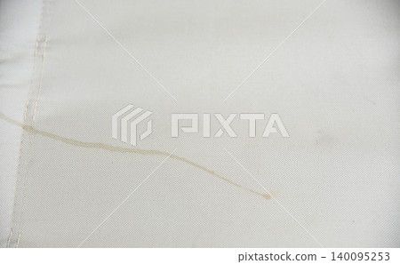 Dirty clothes concept, sweat stains on fabric, laundry problem and stain removal or bleaching service background. Dirty clothes concept, sweat stains on fabric, laundry problem and stain removal or bleaching service background. 140095253