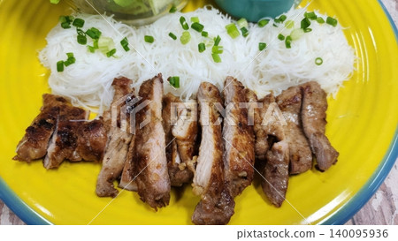 Grilled Marinated Pork Slices Served with Rice Vermicelli and Spring Onions Grilled Marinated Pork Slices Served with Rice Vermicelli and Spring Onions 140095936