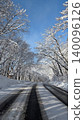 A road stretching across a snowy landscape 140096126