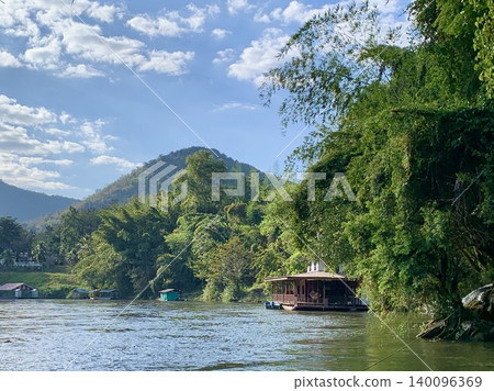 A boat floating on the river under the blue sky of Thailand. 140096369
