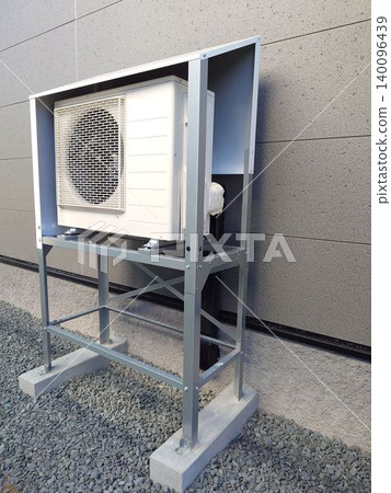 Installation of air conditioner outdoor units with snow protection covers for residential use. Installation of air conditioner outdoor units with snow protection covers for residential use. 140096439