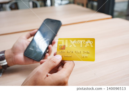 Credit card used for secure online shopping payment and mobile checkout. Credit card used for secure online shopping payment and mobile checkout. 140096513