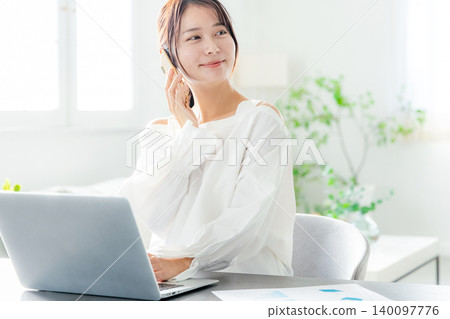 Young women working remotely Young women working remotely 140097776