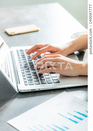 Hands of a woman working on a laptop Hands of a woman working on a laptop 140097777