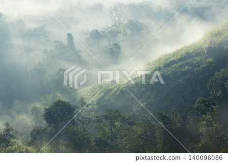 Landscape of Morning Mist with Mountain Layer. mountain ridge and clouds in rural jungle bush forest 140098086