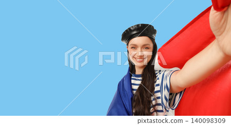 Woman showcases flag representing nation. Celebration and travel concepts Woman showcases flag representing nation. Celebration and travel concepts 140098309