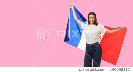 Woman waves French flag, expressing joy in vibrant space 140098311