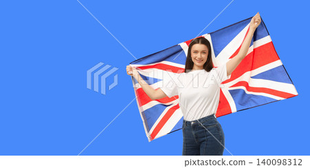 Young woman waves British flag. Celebration and travel culture concept Young woman waves British flag. Celebration and travel culture concept 140098312