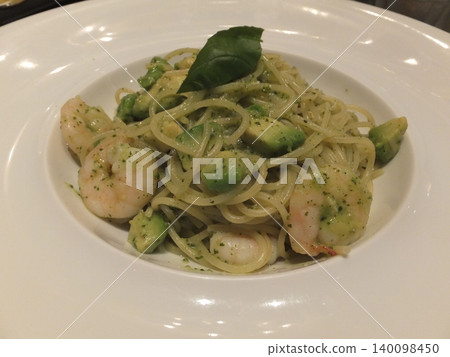 Delicious creamy pasta with basil, shrimp, and avocado Delicious creamy pasta with basil, shrimp, and avocado 140098450