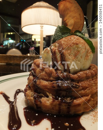 A three-dimensional pie topped with ice cream A three-dimensional pie topped with ice cream 140098451