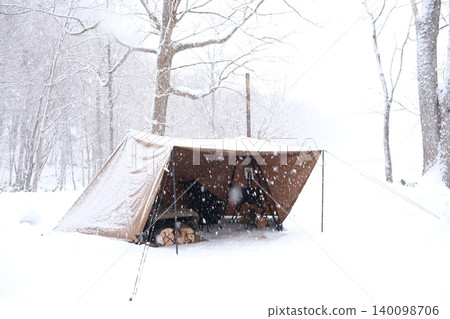 Winter Camping in Hakkensan, Hokkaido: The silence of snow camping and the warmth of a campfire near Sapporo. Winter in Hokkaido. Winter Camping in Hakkensan, Hokkaido: The silence of snow camping and the warmth of a campfire near Sapporo. Winter in Hokkaido. 140098706