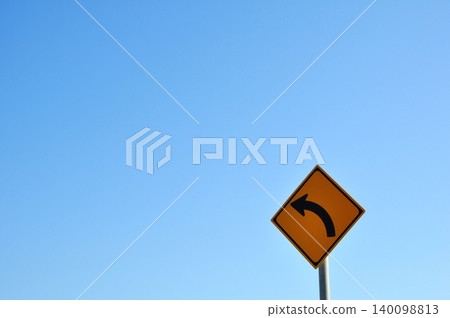 Road sign indicating a left curve Road sign indicating a left curve 140098813