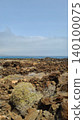 Wide view of Lanzarote desert landscape with volcanic hills and stark island beauty 140100075