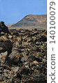 Wide view of Lanzarote desert landscape with volcanic hills and stark island beauty 140100079