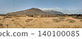 Wide view of Lanzarote desert landscape with volcanic hills and stark island beauty 140100085