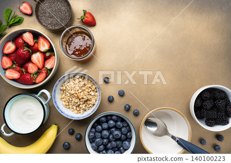 Healthy breakfast ingredients yogurt berries granola Healthy breakfast ingredients yogurt berries granola 140100223