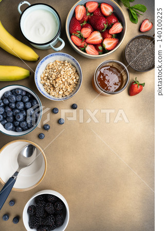 Healthy breakfast ingredients yogurt berries granola Healthy breakfast ingredients yogurt berries granola 140100225