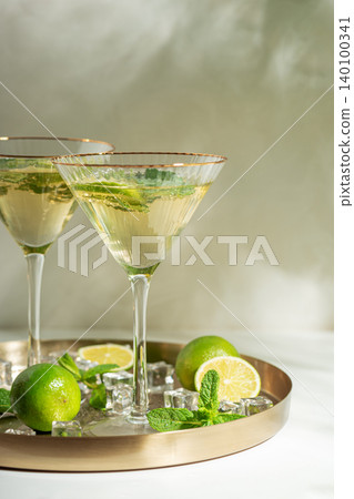 Refreshing summer cocktail drinks with lime and mint Refreshing summer cocktail drinks with lime and mint 140100341