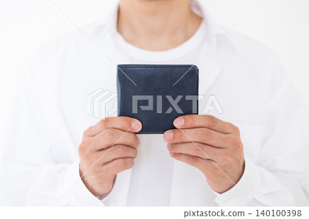 A middle-aged man carrying a wallet A middle-aged man carrying a wallet 140100398