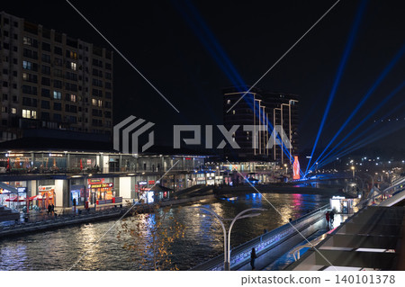 Tashkent, Uzbekistan - February 02, 2026: Seoul Mun Street. Blue Light Show at Seoul Mun Riverside District in Tashkent at Night. Tashkent, Uzbekistan - February 02, 2026: Seoul Mun Street. Blue Light Show at Seoul Mun Riverside District in Tashkent at Night. 140101378