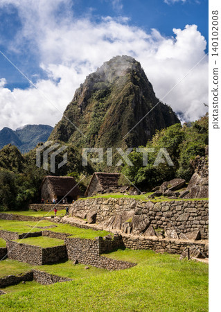 Panoramic view of Machu Picchu ruins with Huayna Picchu in background, Peru Panoramic view of Machu Picchu ruins with Huayna Picchu in background, Peru 140102008