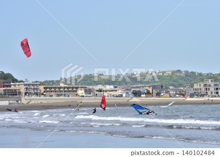 People enjoying windsurfing at Katase Higashihama Beach 140102484