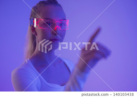 Woman Interacting with Virtual Interface 140103438