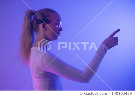 Futuristic woman navigating virtual interface 140103439