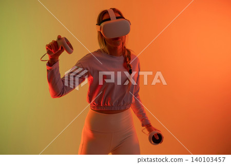 Woman Using Virtual Reality Headset Woman Using Virtual Reality Headset 140103457