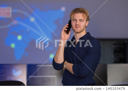 Confident cybersecurity analyst discusses strategies in a high-tech SOC environment 140103479