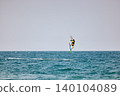 Nha Trang, Khanh Hoa, Vietnam - April 4, 2026: Kitesurfer Performing High Jump Above Waves in Nha Trang 140104089