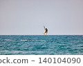 Nha Trang, Khanh Hoa, Vietnam - April 4, 2026: Kitesurfer Performing High Jump Above Waves in Nha Trang 140104090