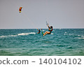 Nha Trang, Khanh Hoa, Vietnam - April 5, 2026: Kitesurfer Performing Jump Above Waves in Nha Trang 140104102