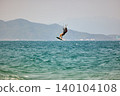 Nha Trang, Khanh Hoa, Vietnam - April 5, 2026: Kitesurfer Performing High Jump Above Waves in Nha Trang 140104108