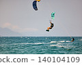 Nha Trang, Khanh Hoa, Vietnam - April 5, 2026: Kitesurfer Performing High Jump Above Waves in Nha Trang 140104109