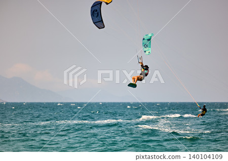 Nha Trang, Khanh Hoa, Vietnam - April 5, 2026: Kitesurfer Performing High Jump Above Waves in Nha Trang Nha Trang, Khanh Hoa, Vietnam - April 5, 2026: Kitesurfer Performing High Jump Above Waves in Nha Trang 140104109