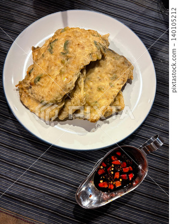 Traditional fried tempeh served with chili soy sauce indonesian culinary Traditional fried tempeh served with chili soy sauce indonesian culinary 140105212