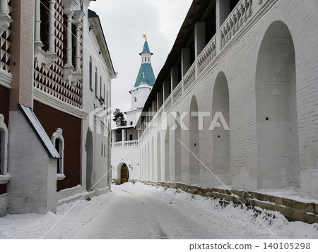 Historic Monastery Fortress Walls and Watchtower in Winter. Majestic White Stone Architecture Historic Monastery Fortress Walls and Watchtower in Winter. Majestic White Stone Architecture 140105298